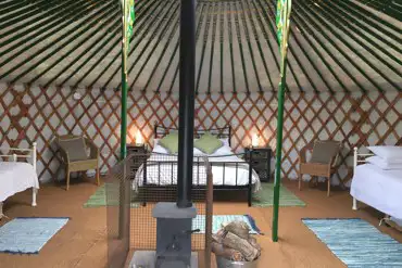 Our Yurts are furnished with comfortable beds, electricity and a woodturning stove.