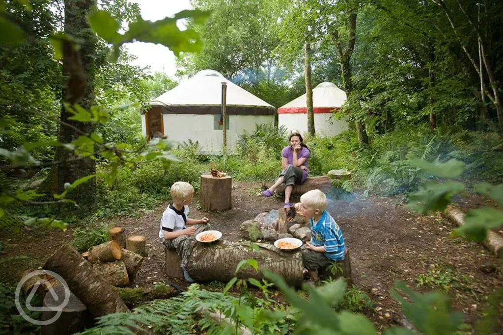 Yurts at camp with their firepits