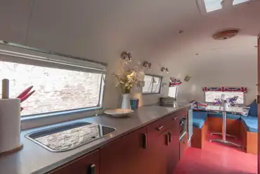 Airstream has an onboard kitchen and flushing toilet.