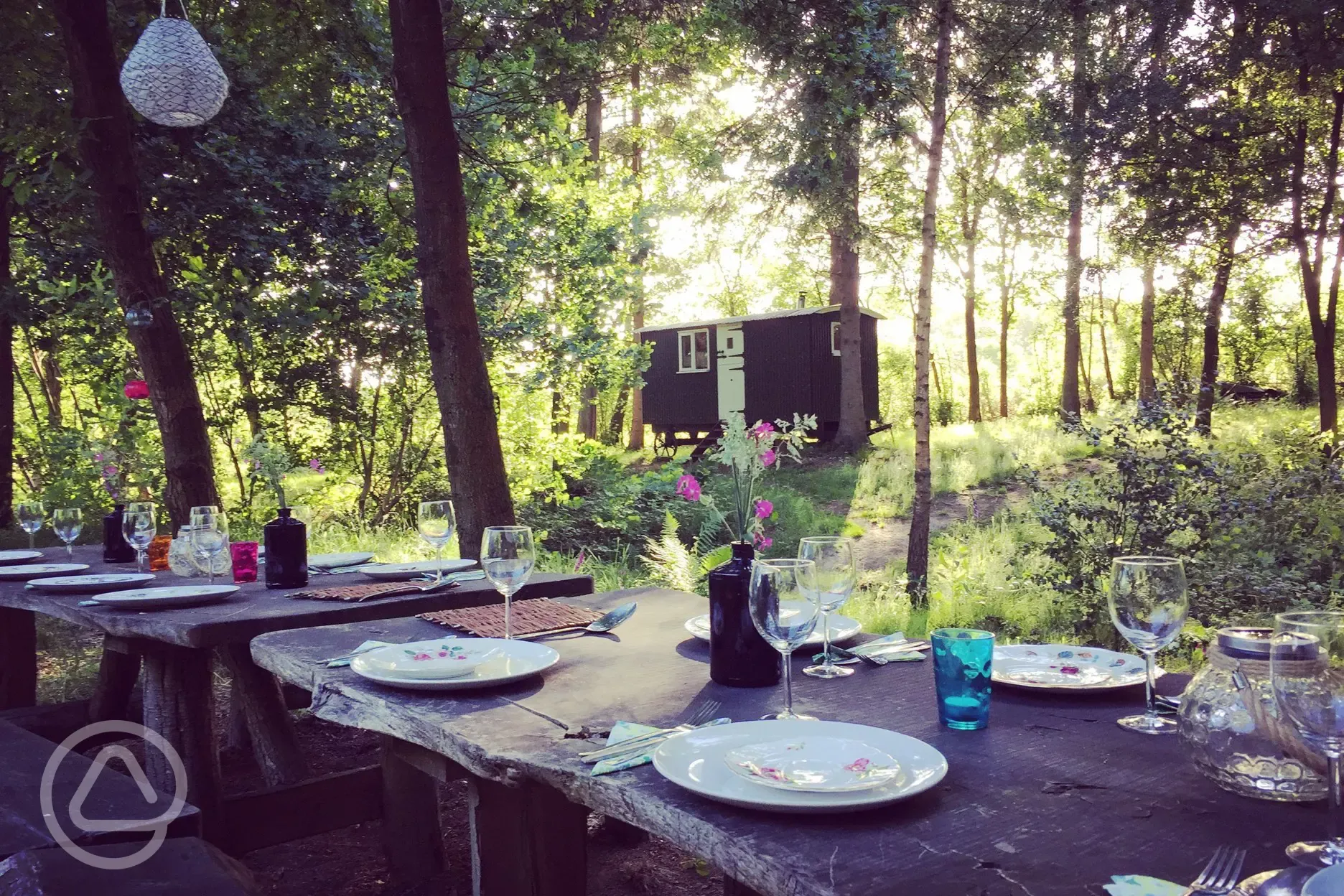 Dining alfresco on our rustic tables and benches.