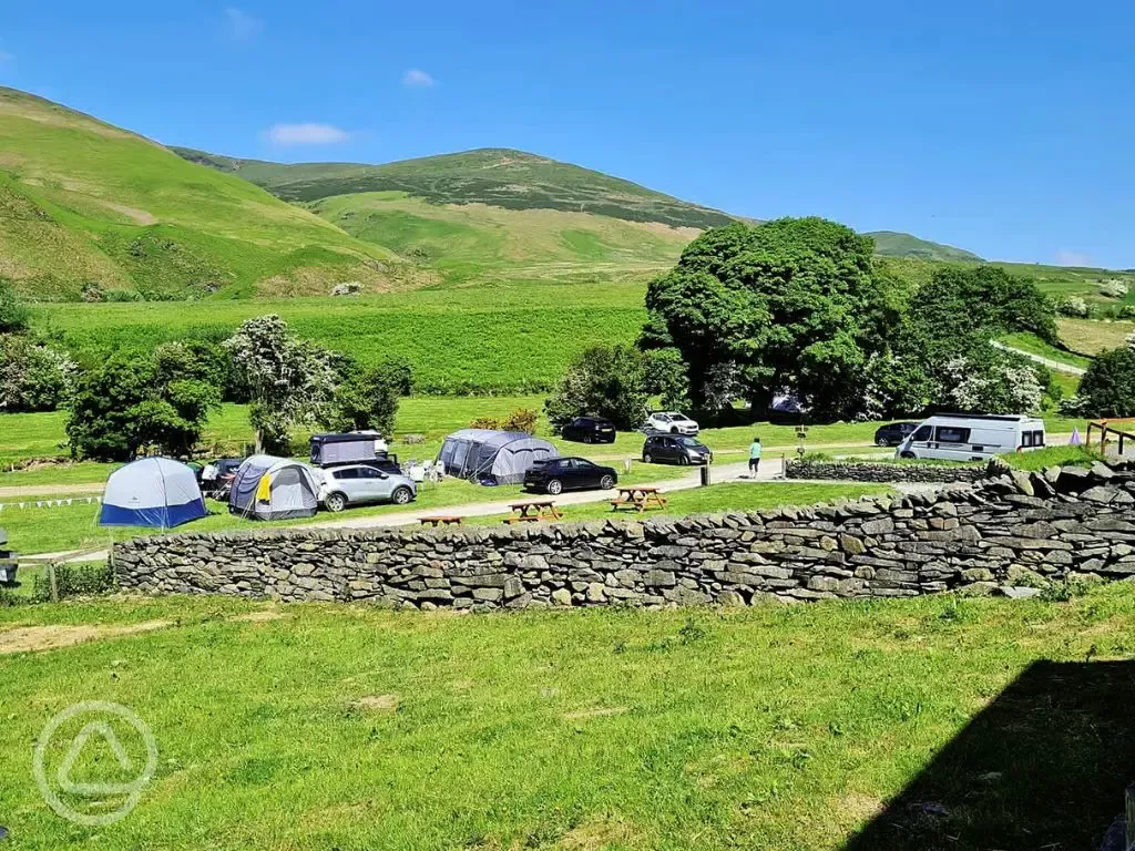 Large tents on grass pitches at Baystone Bank Farm overlooking Cumbrian fells Large tents on grass pitches at Baystone Bank Farm overlooking Cumbrian fells