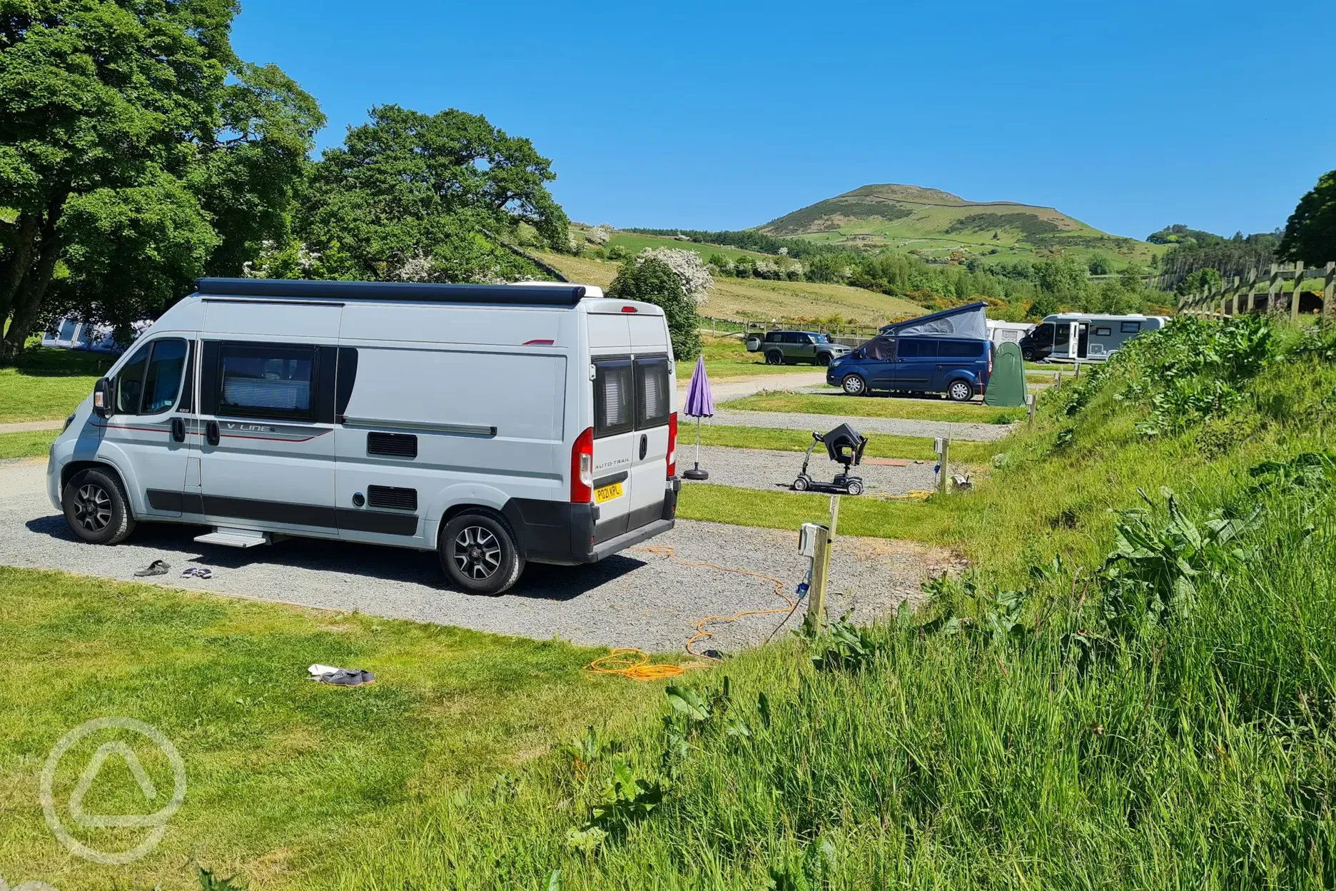 Electric hardstanding pitches overlooking the mountains Electric hardstanding pitches overlooking the mountains