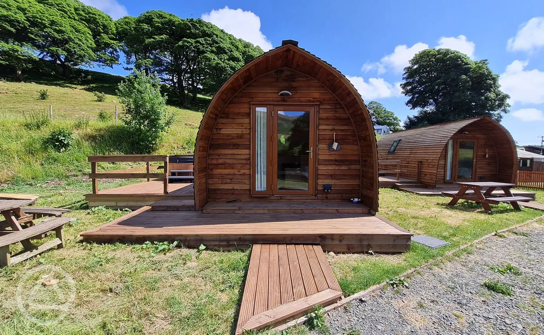 Camping pod exterior with private decking Camping pod exterior with private decking