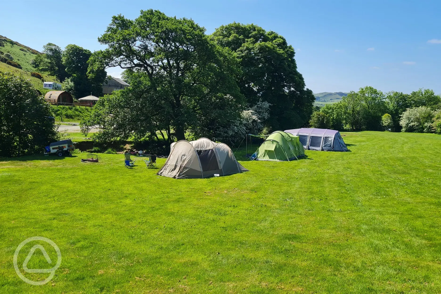 Grass pitches with space for a parked car Grass pitches with space for a parked car