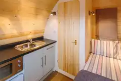 Ensuite glamping pod kitchenette with a microwave and sink Ensuite glamping pod kitchenette with a microwave and sink