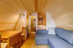 Ensuite glamping pod dining area and an L-shape sofa Ensuite glamping pod dining area and an L-shape sofa