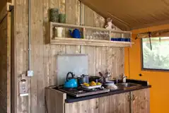 Safari tent kitchenette with a gas hob, kettle and toaster Safari tent kitchenette with a gas hob, kettle and toaster