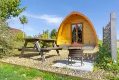 Ensuite glamping pods with a picnic bench and fire pit at Notgrove Holidays Ensuite glamping pods with a picnic bench and fire pit at Notgrove Holidays