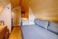 Ensuite glamping pod L-shape sofa folded out to a double sofa bed Ensuite glamping pod L-shape sofa folded out to a double sofa bed