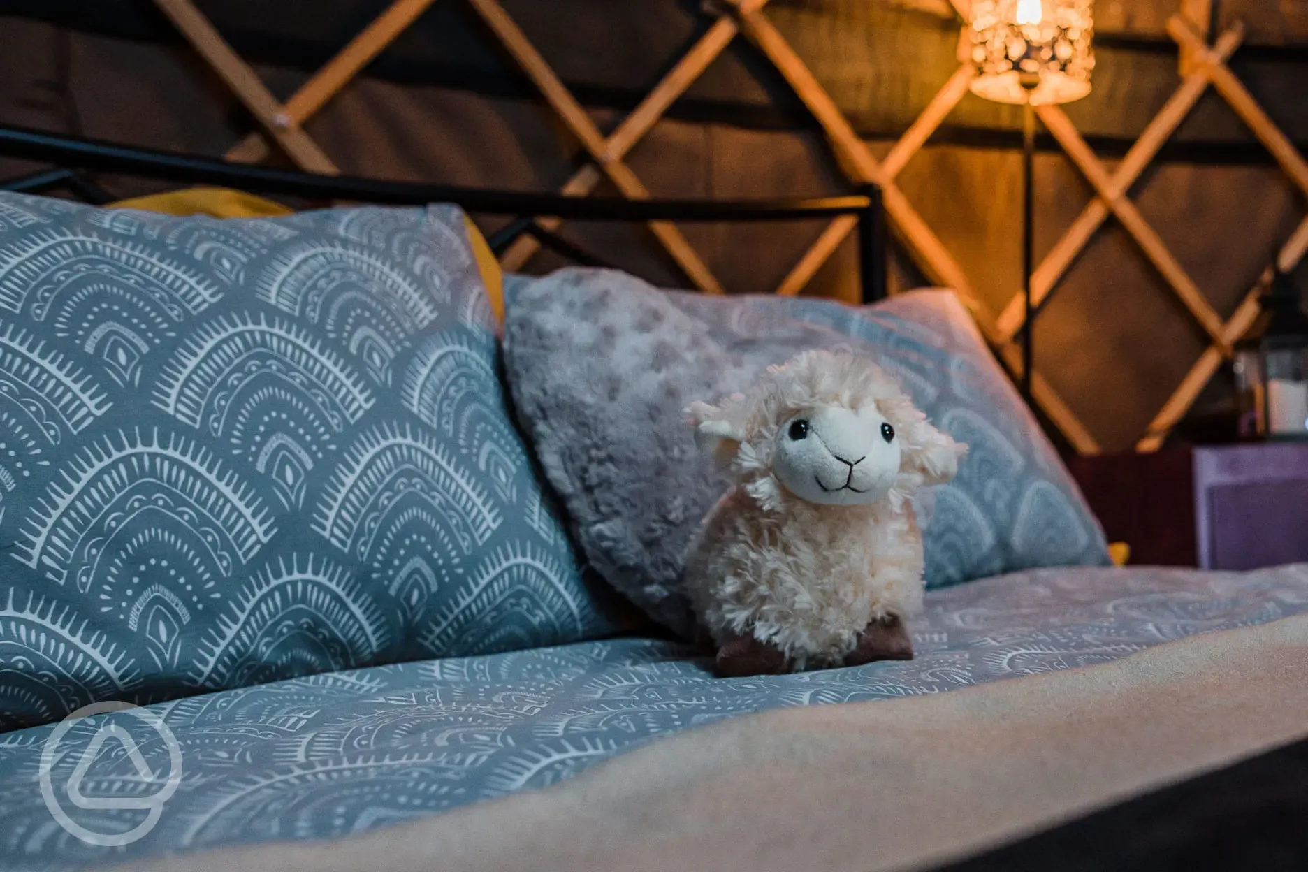 Cosy bed with toy sheep welcoming you