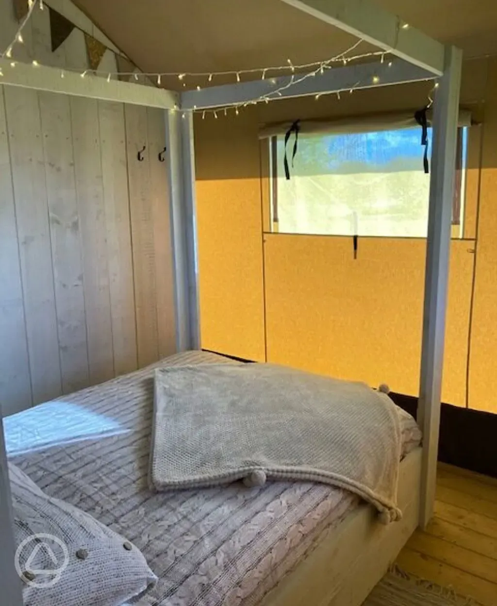 Four poster beds in safari tents