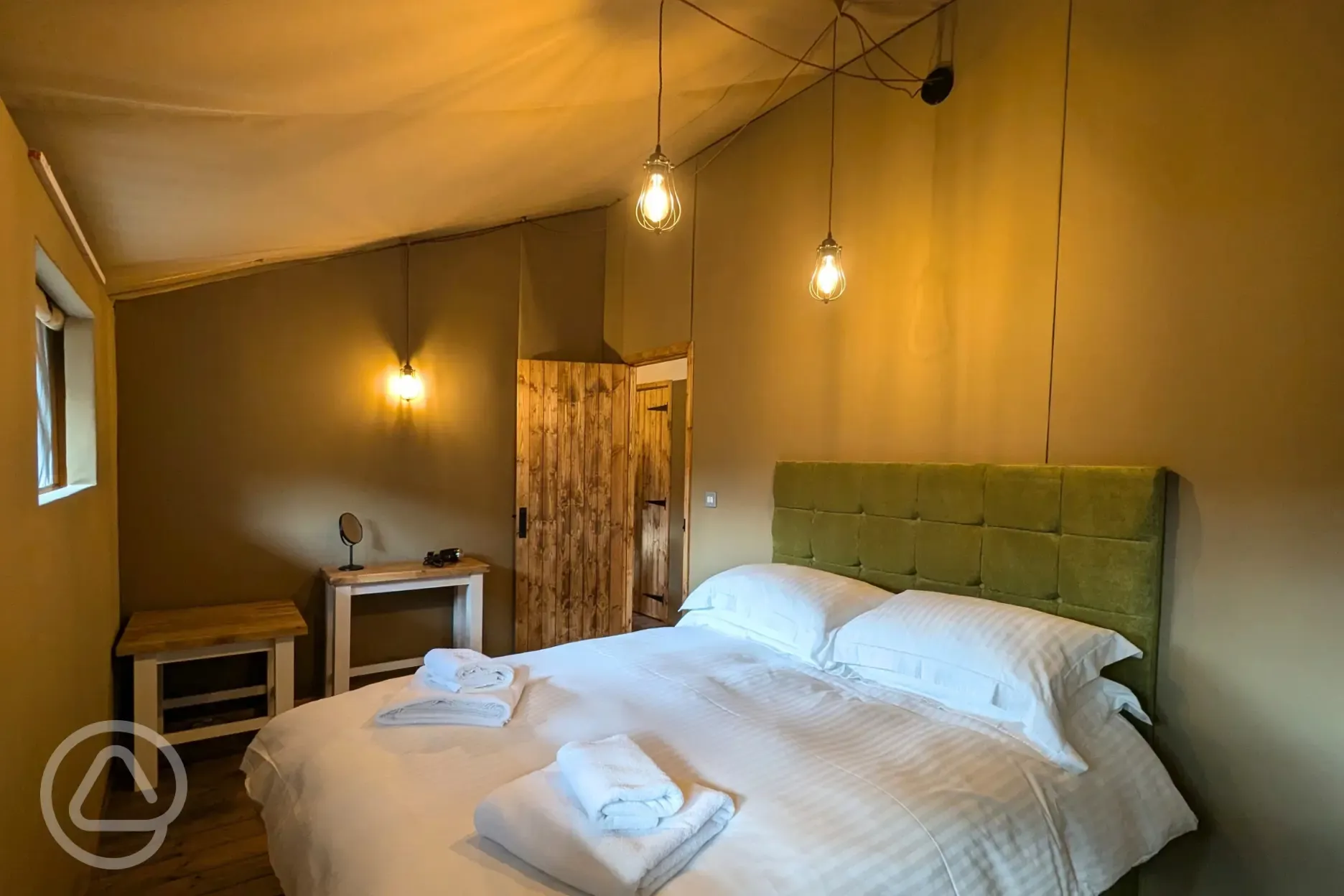 Luxury adult only safari tent queen bed with bedding provided