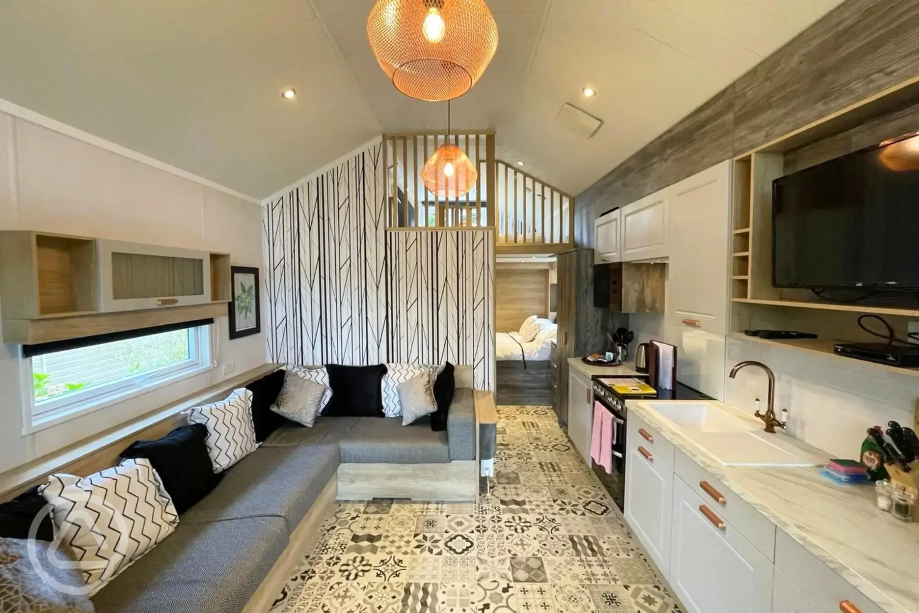 Family hideaway interior with a two double sofa beds and a mezzanine level