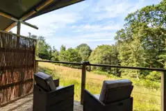 Luxury adult only safari tents outdoor deck areas with countryside views