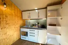 Luxury tent kitchen with a dishwasher, microwave/oven, fridge, toaster, kettle