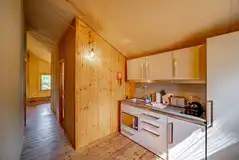 Luxury adult only safari tent kitchen with a dishwasher, oven, fridge and kettle