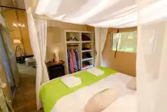 Safari tent king size bedroom with bedding provided