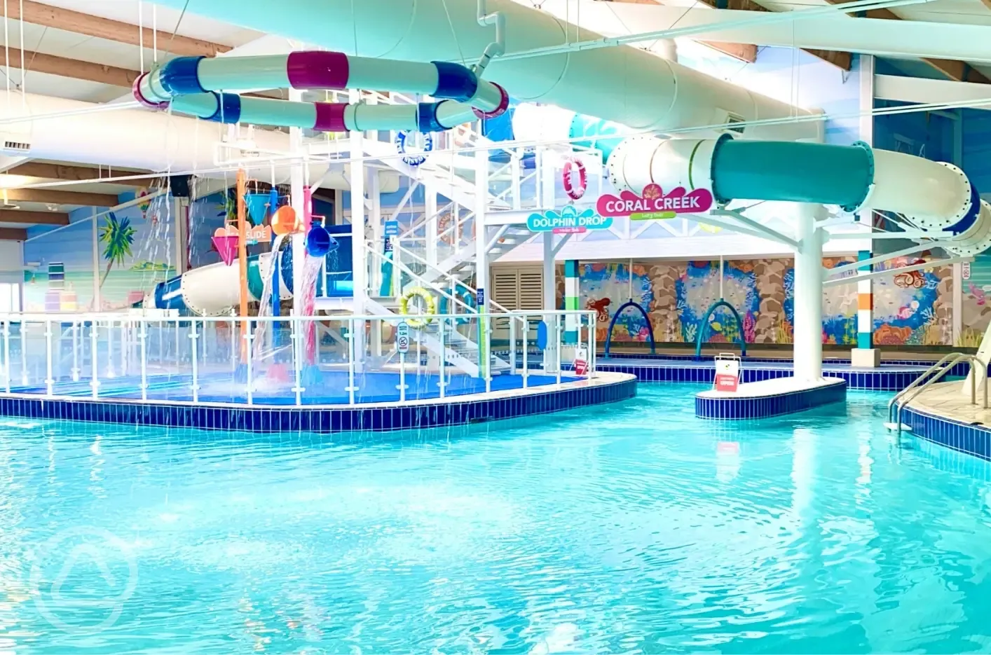 Indoor swimming pool with slides and a lazy river
