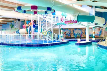 Indoor swimming pool with slides and a lazy river