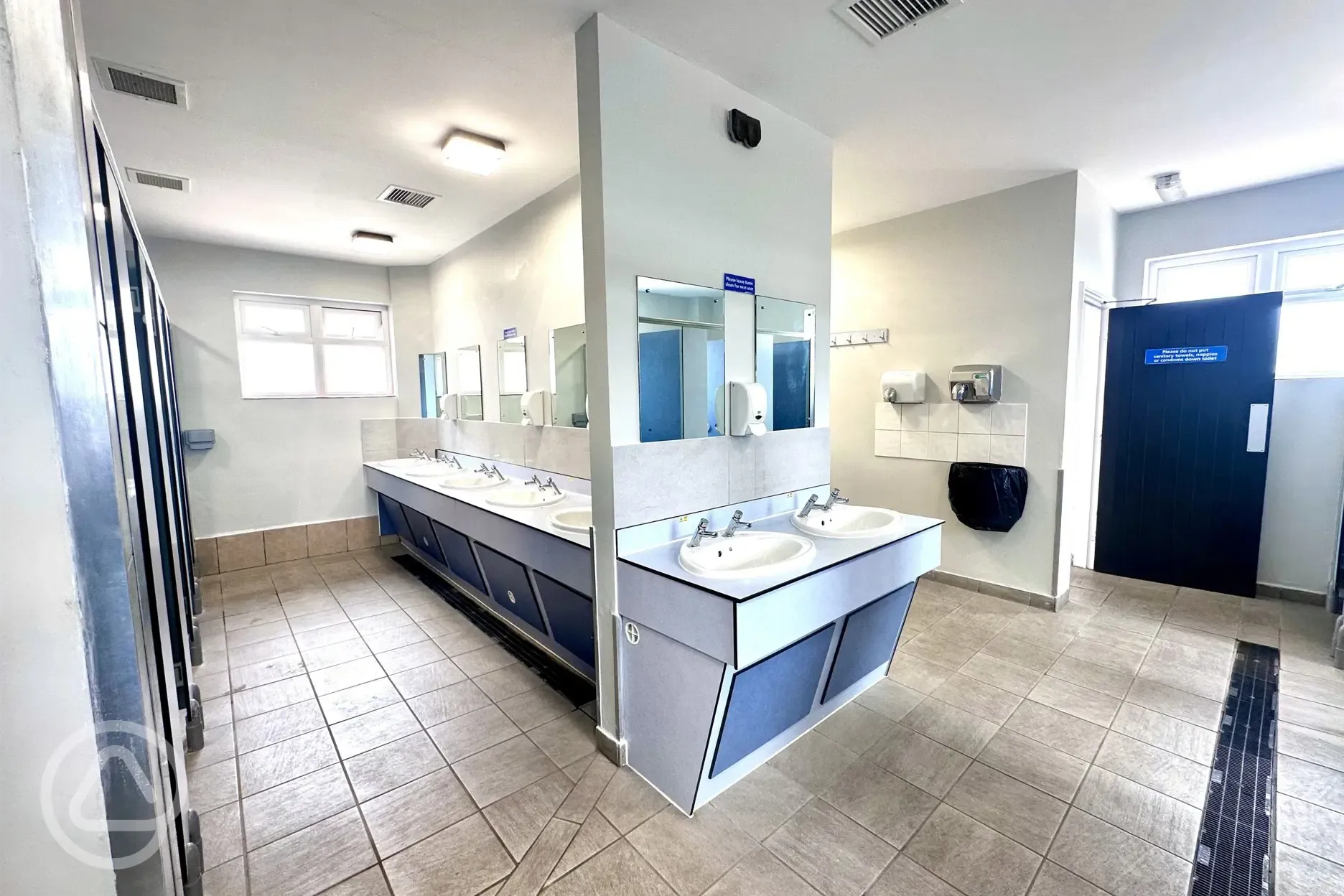 Sinks and toilets with mirrors and hand dryers
