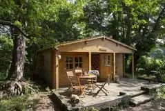 Woodland lodge with a decking area Woodland lodge with a decking area