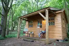 Cedar Lodge exterior with sheltered outdoor seating 