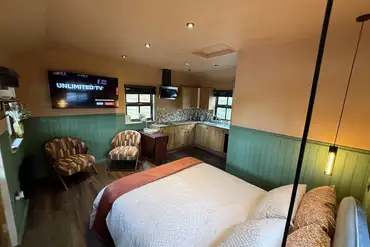 Cedar lodge glamping cabin with a king bed, smart TV and kitchen