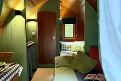 Pod interior with a double bed and double sofa bed (bedding provided) Pod interior with a double bed and double sofa bed (bedding provided)