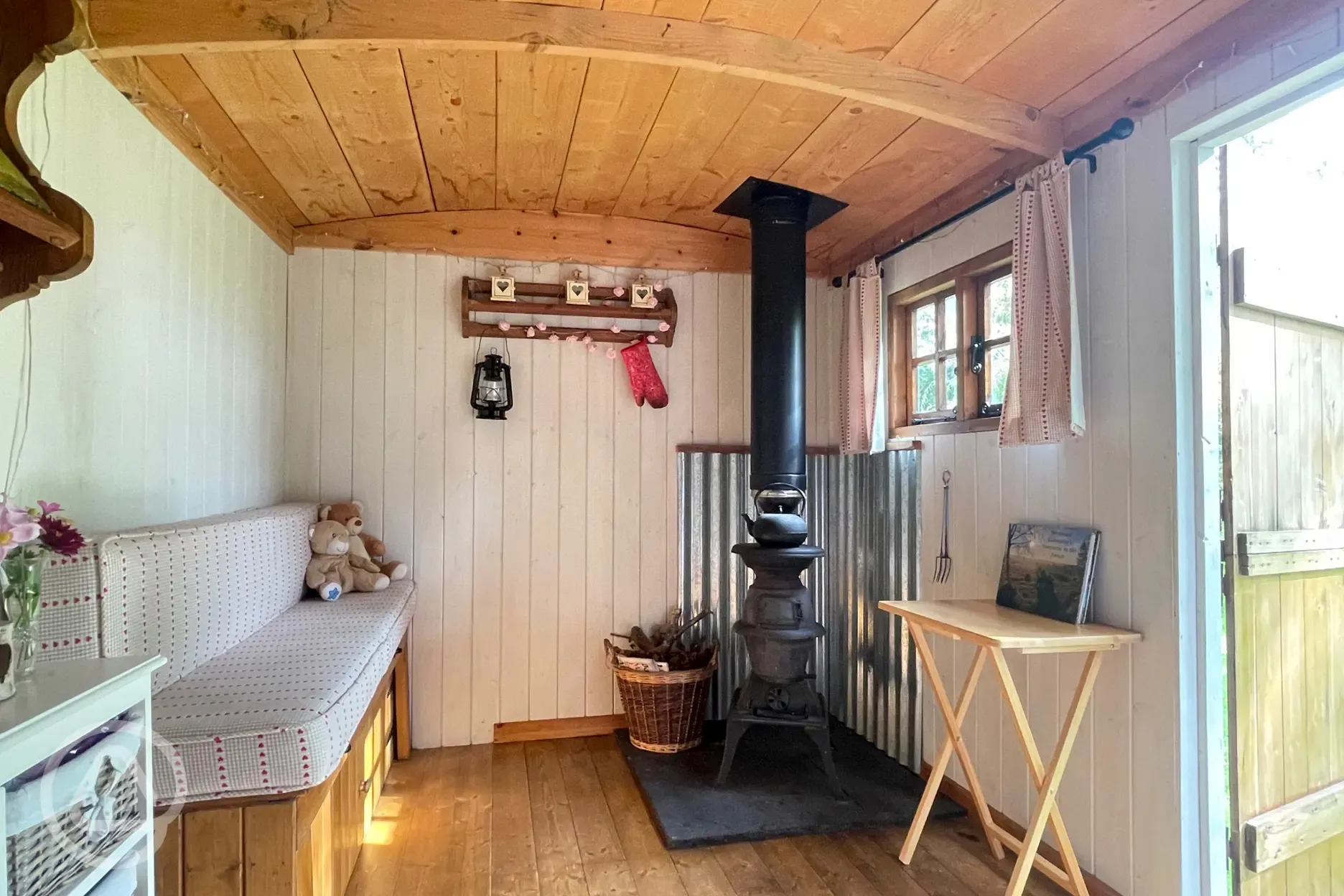 Shepherd hut interior with a wood burner