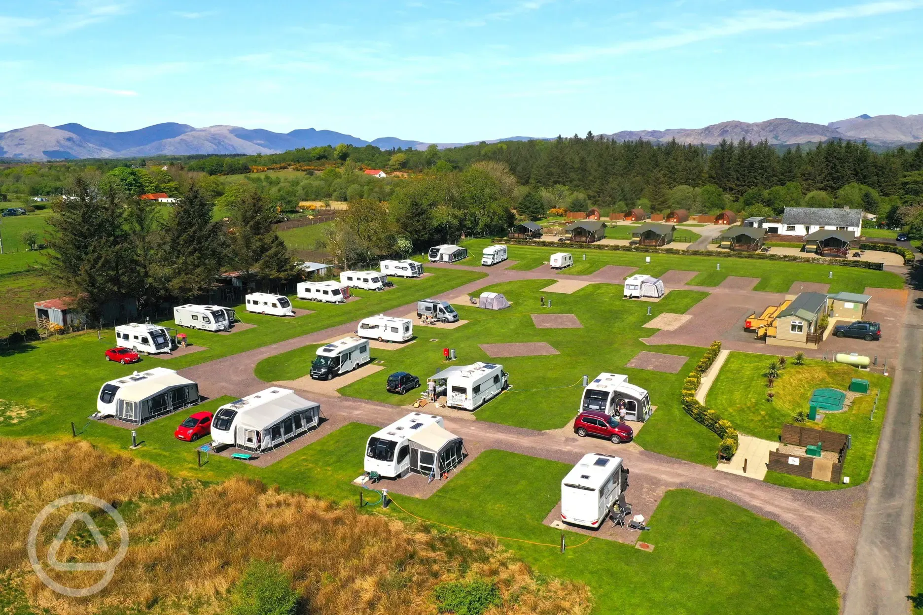 Aerial of the hardstanding and fully serviced pitches at Highfield Holidays