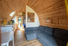 Alpaca pod with an L-shaped sofa, a double bed and kitchen (bring bedding)