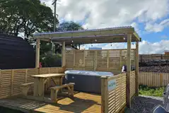 Fully serviced hardstanding pitch with hot tub