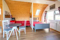Owl pod with a double bed, sofa and dining area (bring bedding)