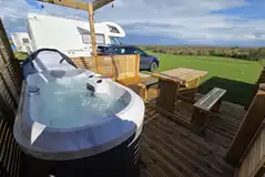 Fully serviced hardstanding pitch with hot tub
