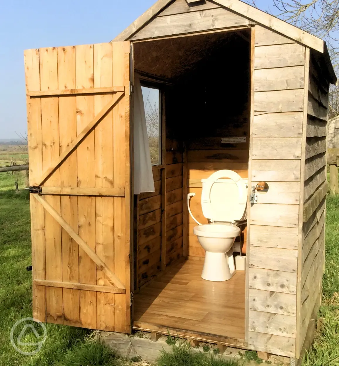 Ensuite grass pitch private toilet facilities