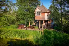 Wee Tree Howf Treehouse with pond views and an optional wood-fired hot tub
