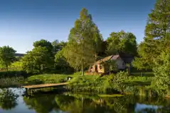 Whisky Howf Cabin with views of a lake