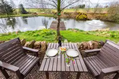 Whisky Howf Cabin outdoor seating area with lake views