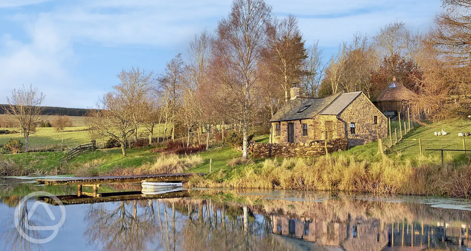 Whisky Howf Cabin with views of a lake