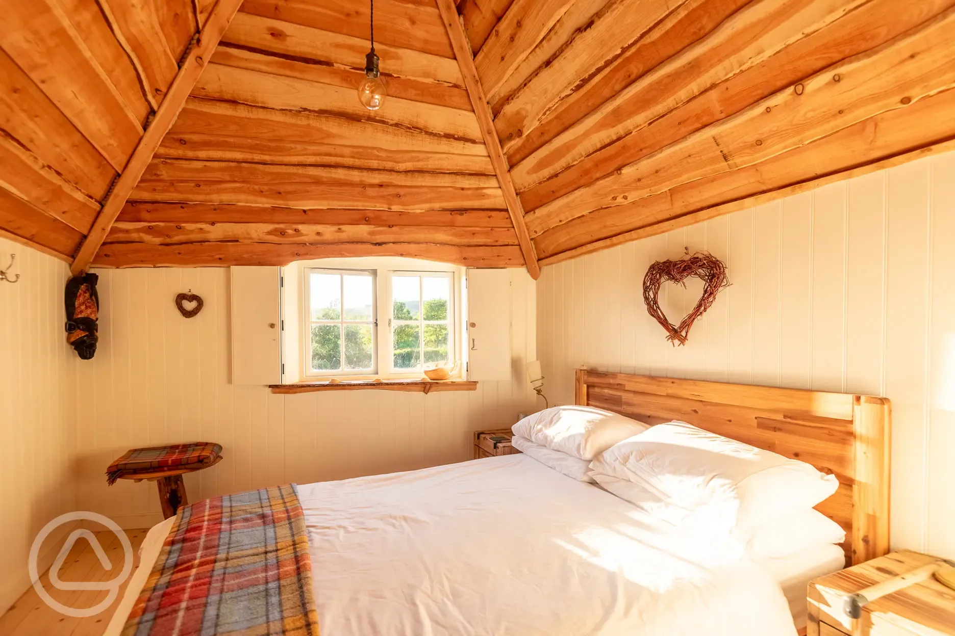 Wee Tree Howf Treehouse with a double bedroom with bedding provided