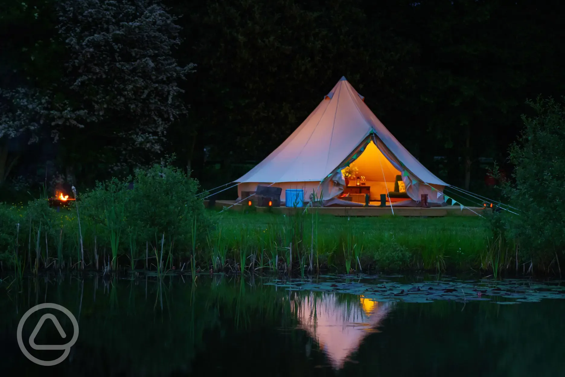 Bell tent next to pond