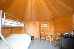 Camping cabin with a triple bunk bed and fold-away single camp bed Camping cabin with a triple bunk bed and fold-away single camp bed