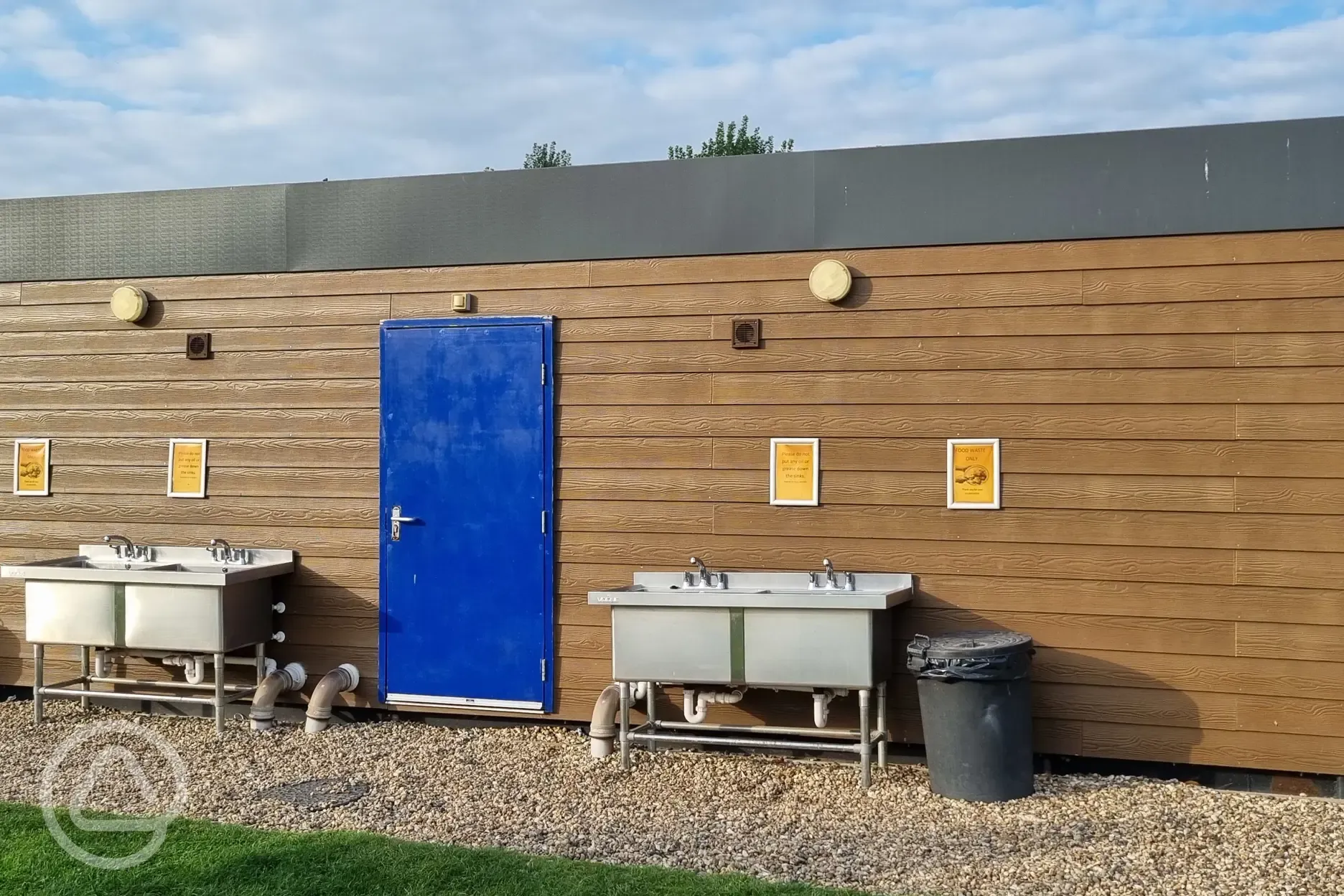 Facilities building with outdoor washing up sinks