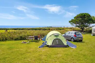 Non electric grass pitch with sea views at Dropped Anchor Sea View Camping