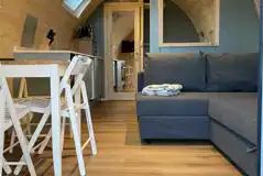 Mega ensuite glamping pod dining and living area