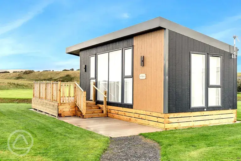 Glamping S-pod with a raised deck area