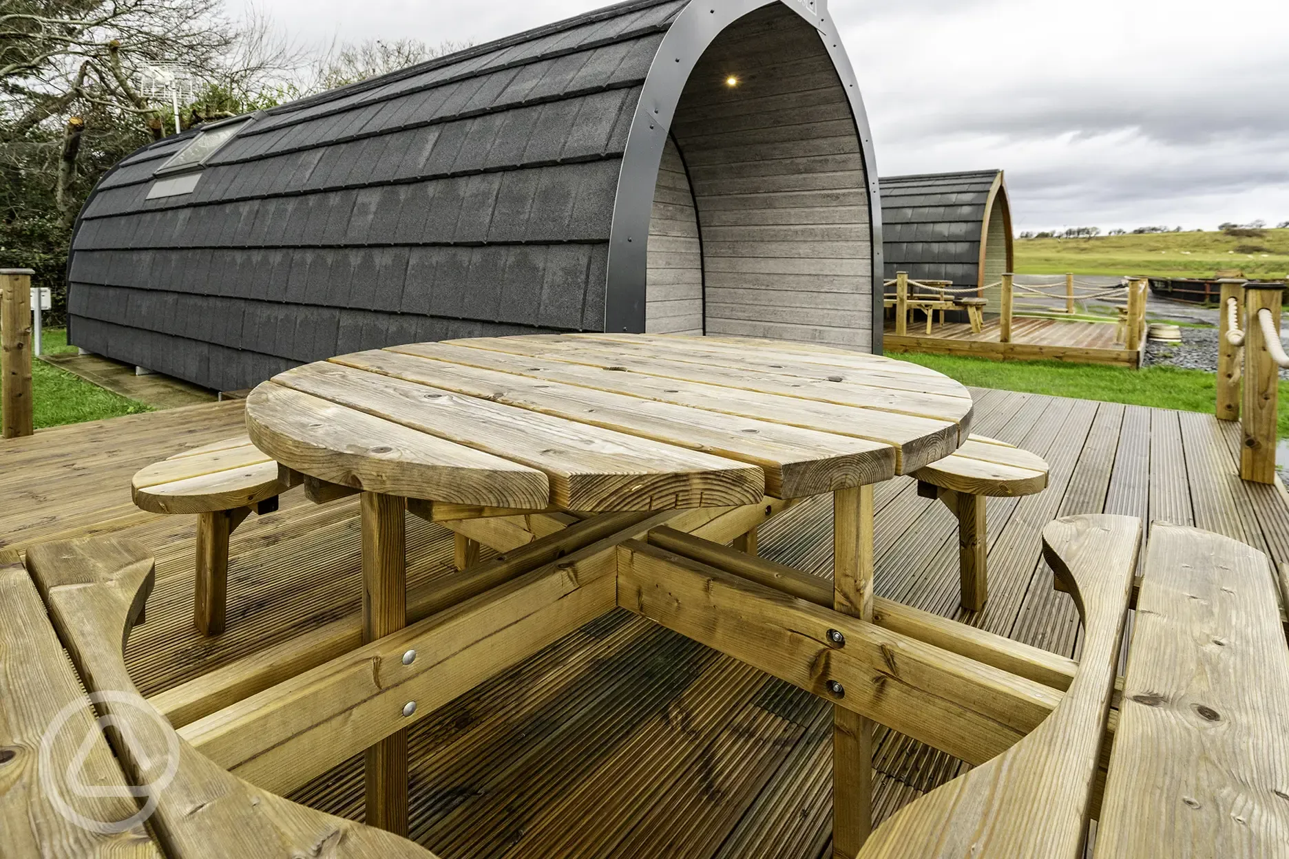 Mega glamping pod with outdoor deck and bench
