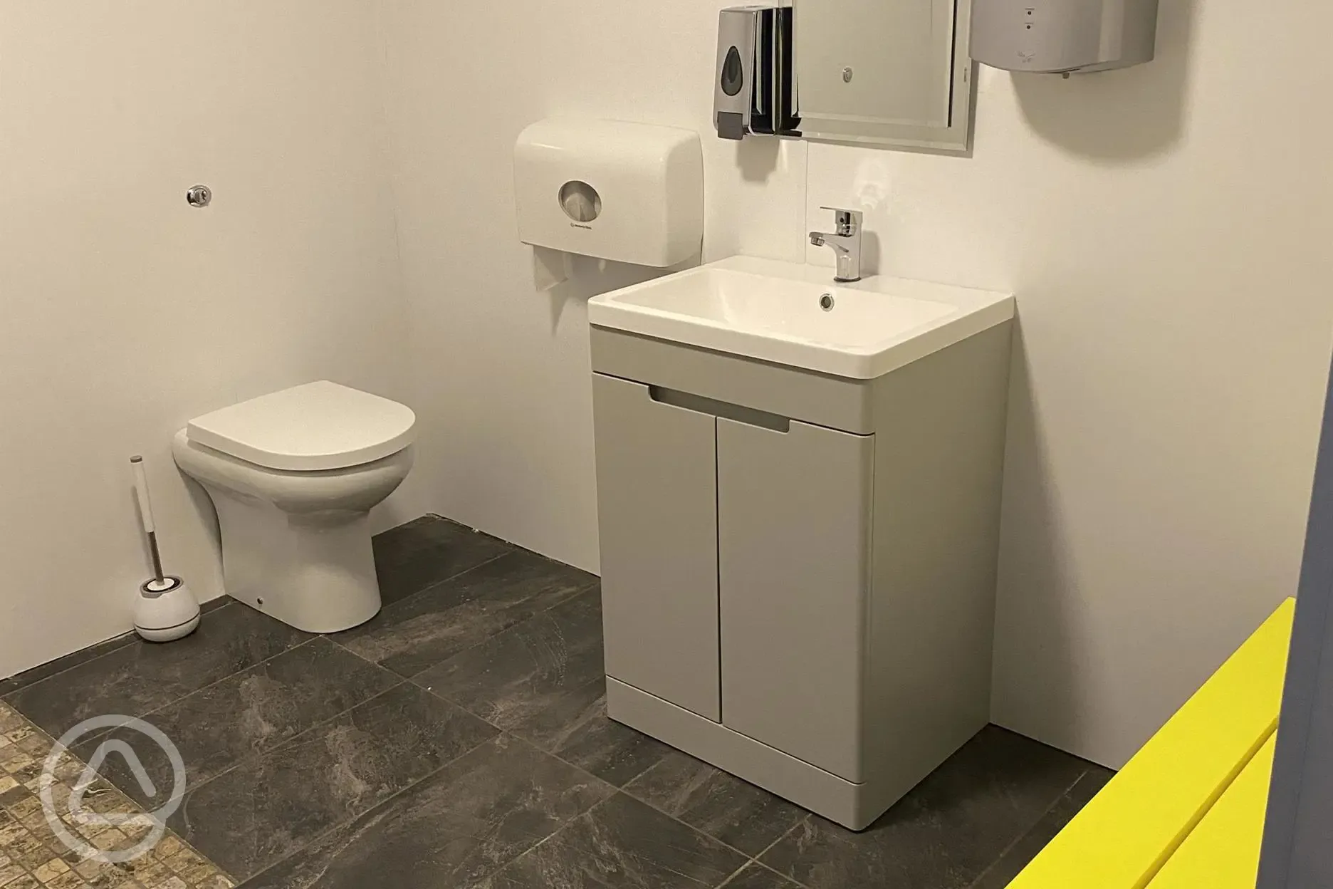 Family washroom with shower and benches 