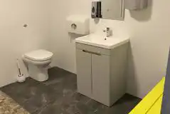 Family washroom with shower and benches 