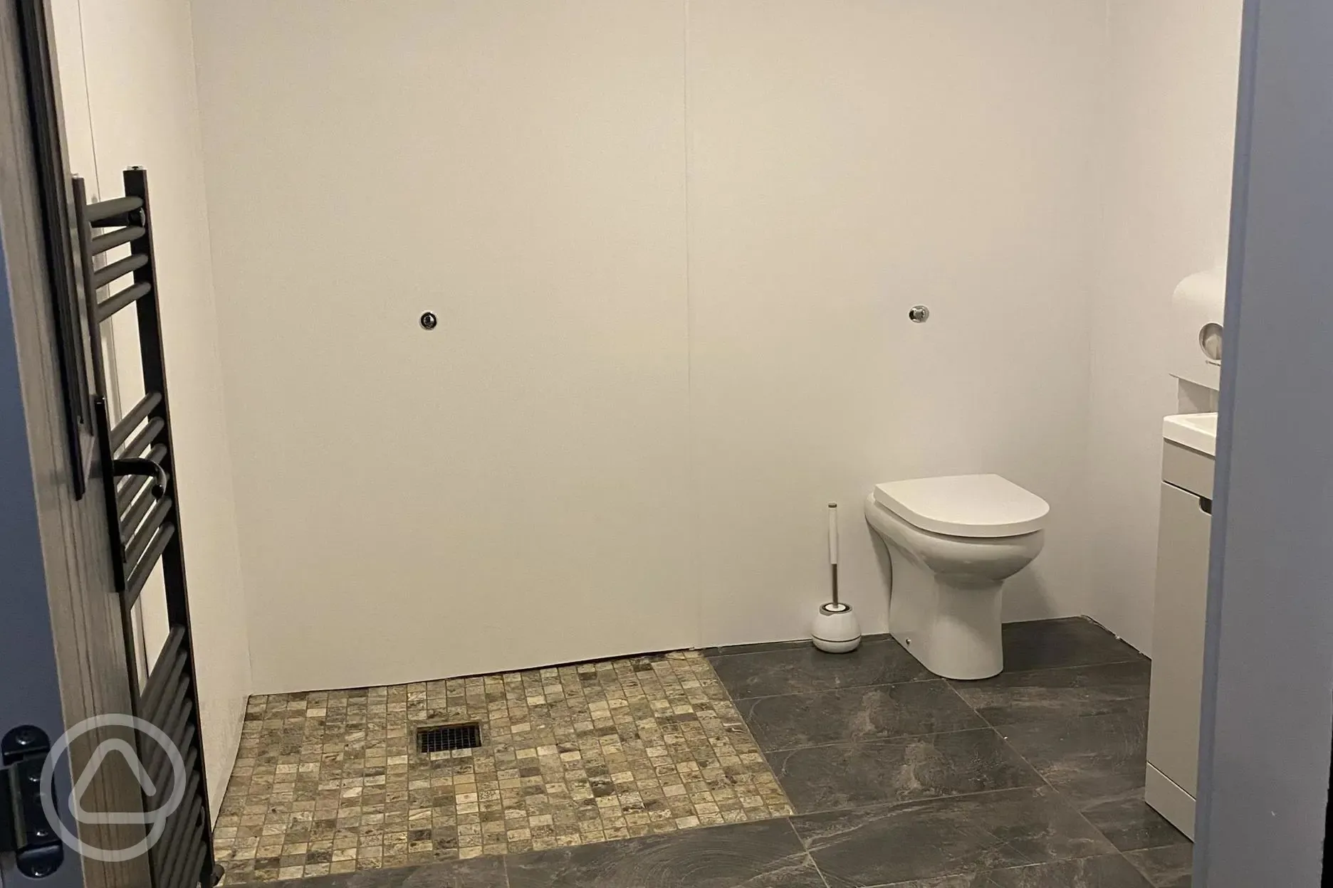 Family washroom with spacious shower and towel railing